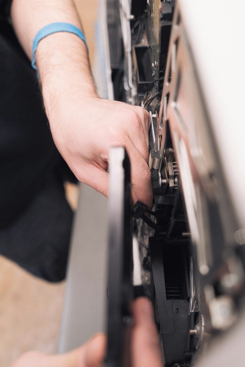 A dishwasher is repaired.