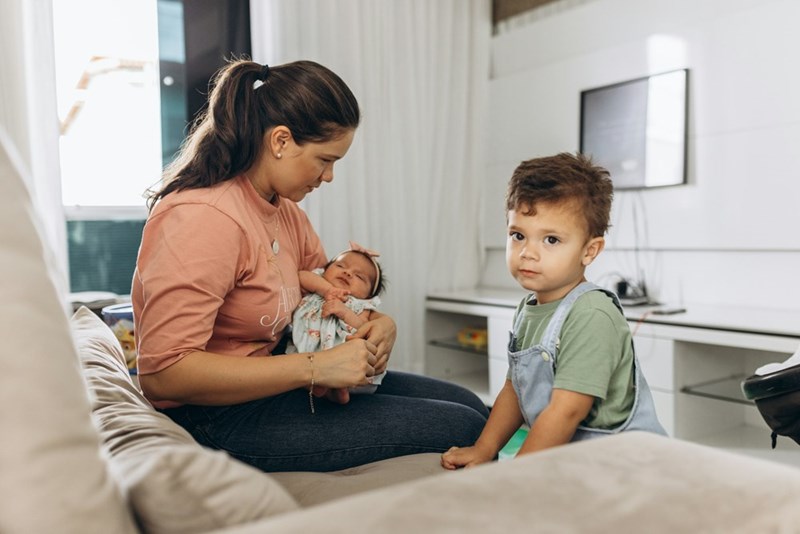 Mother with two children of different ages.