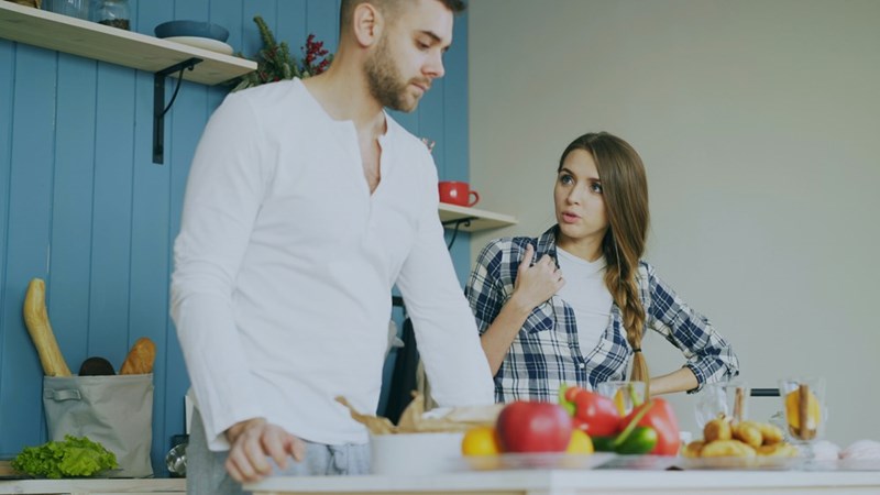 A husband and wife have an argument in the kitchen