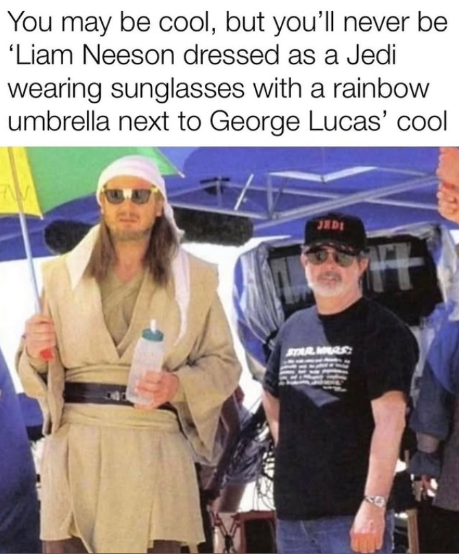 You may be cool, but you'll never be 'Liam Neeson dressed as a Jedi wearing sunglasses with a rainbow umbrella next to George Lucas' cool JEDI STAR.MARS