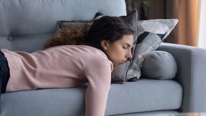 Woman sleeping on a couch.