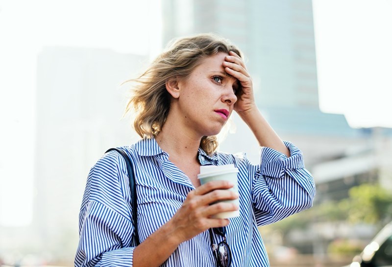 Tensed woman is late for work