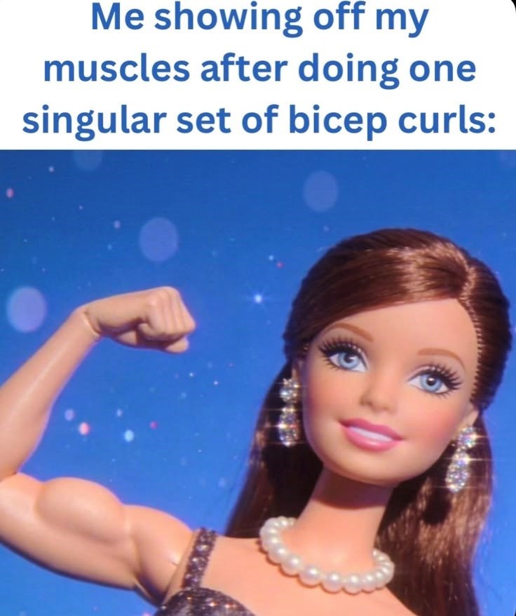 Me showing off my muscles after doing one singular set of bicep curls: