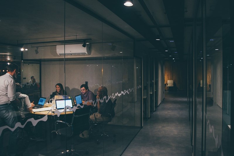 An office space full of employees working.