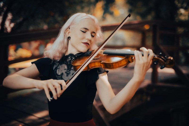 A woman playing the violin. Image is representative only and does not depict the actual subjects of the story.