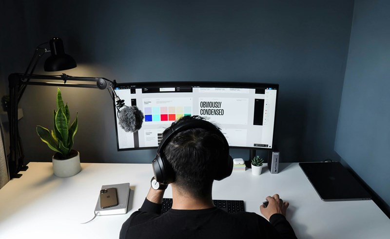 A man working as a freelancer on his computer. Image shown for illustrative purposes; person depicted is a model.