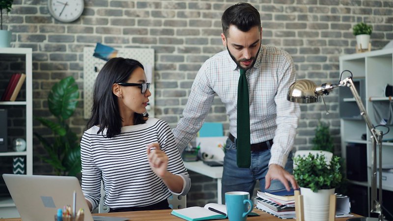 Employee talks with his coworkers after refusing to cancel his paid weekend trip to cover their shift.