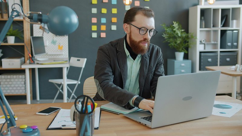 The longtime employee sits at his desk after being moved into a newly created “Senior Advisor” role with the same salary but no clear responsibilities.