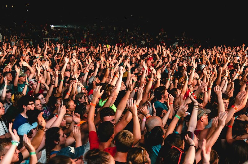 Photography of people gathering near outdoor during nighttime