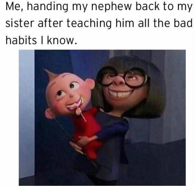Me, handing my nephew back to my sister after teaching him all the bad habits I know.