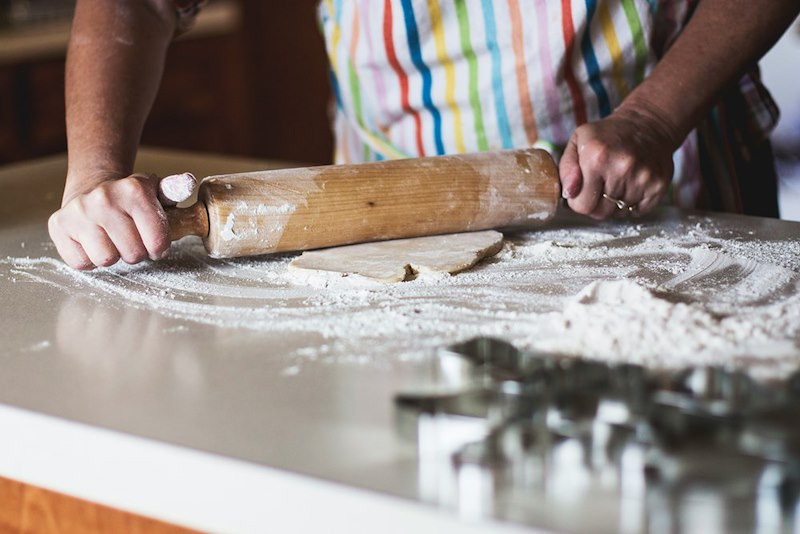 A person cooking cookies.