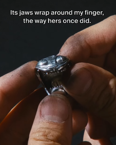Its jaws wrap around my finger, the way hers once did.