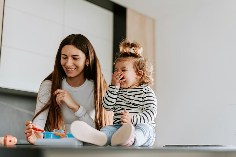 Aunt spends time with her young niece.
