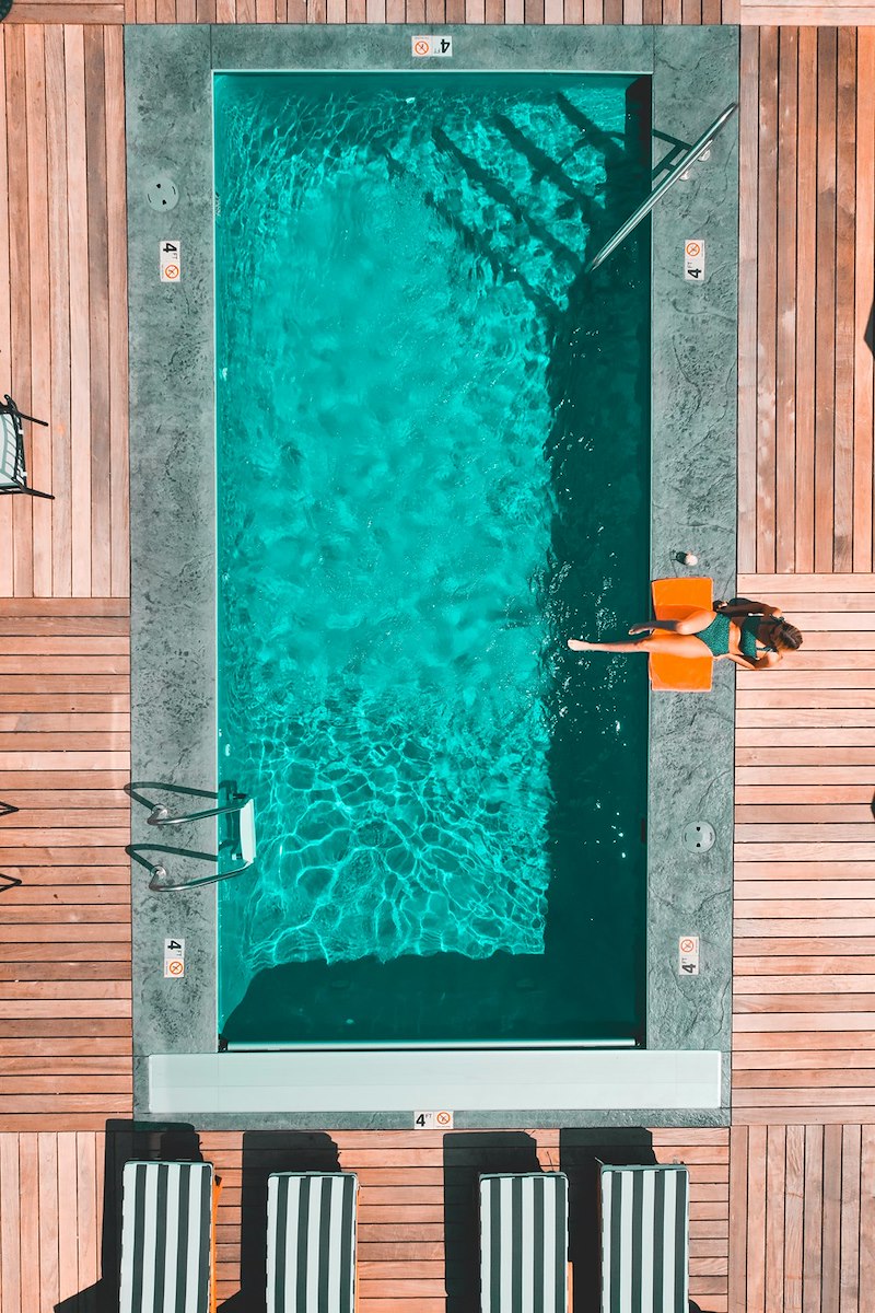 Hotel swimming pool with a guest.
