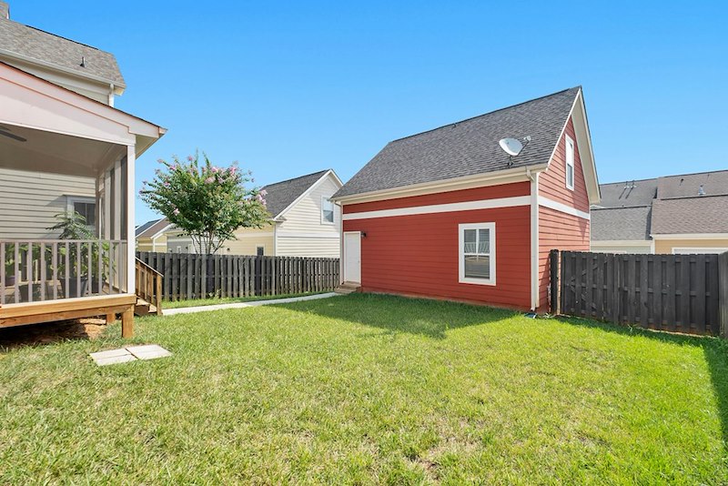 A shared backyard between two townhouses, as in the events of the story.