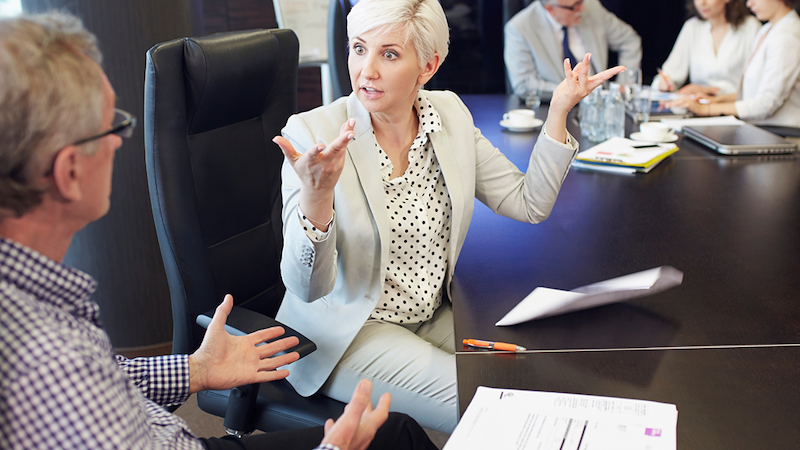 Woman having a dispute with coworker.