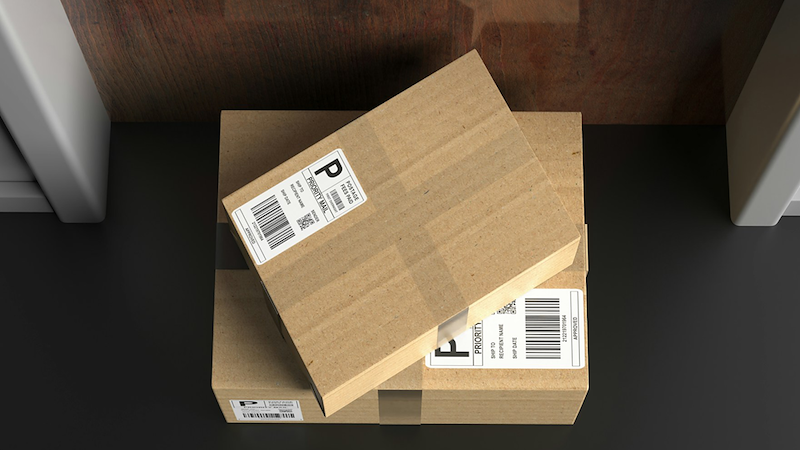 Packages are placed in front of a door.