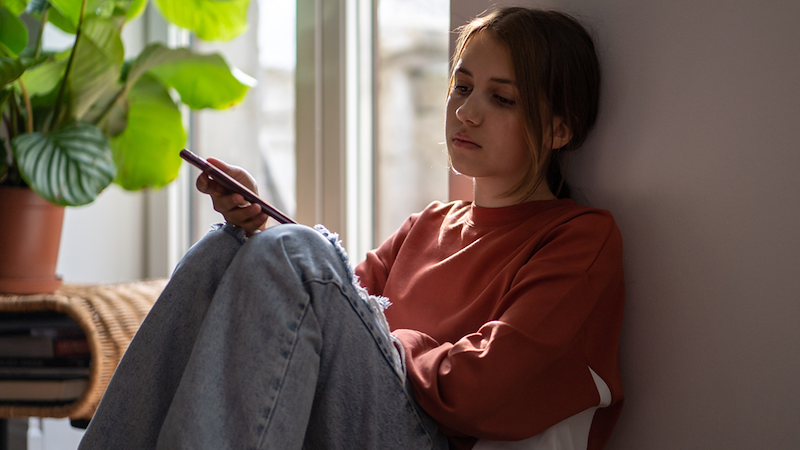 Upset girl with phone.