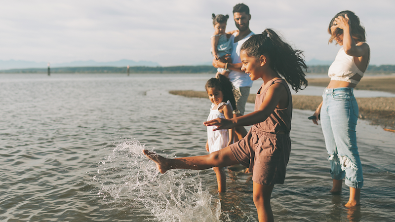 Family with kids at the beach.