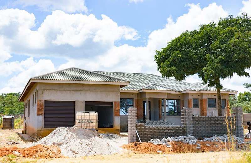 House under construction with brick accents