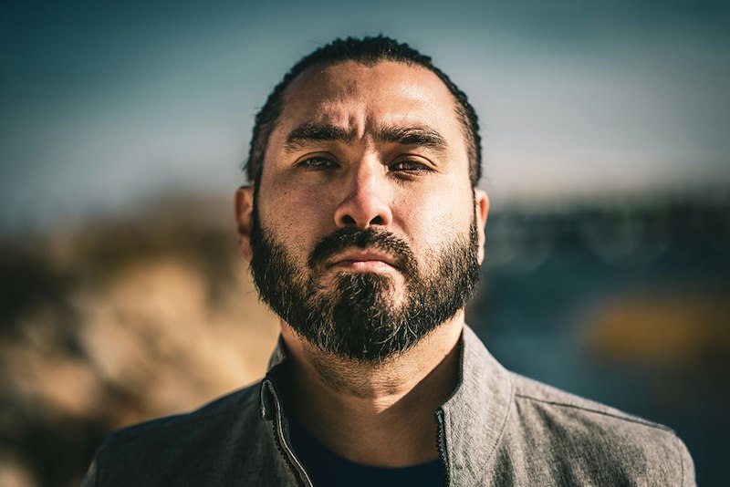 A close-up of a man with a beard