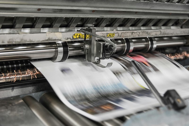 A printing machine working.