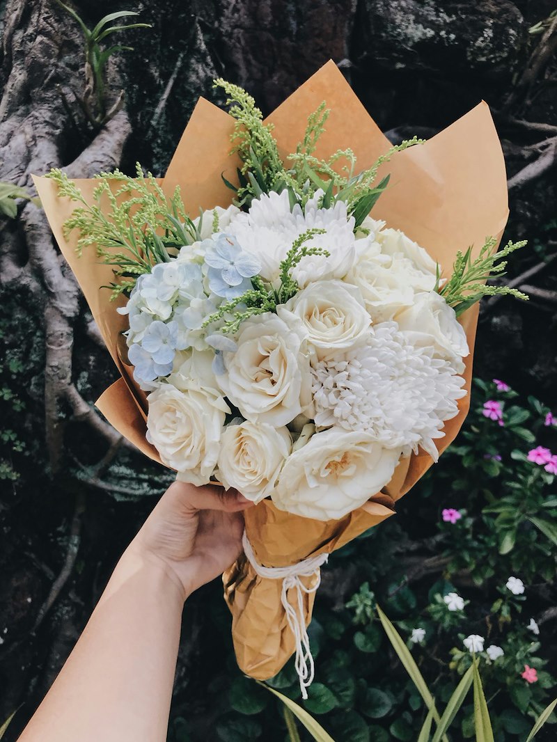 The lovely bouquet a 24-year-old wedding guest catches after two other guests encourage her to join in.