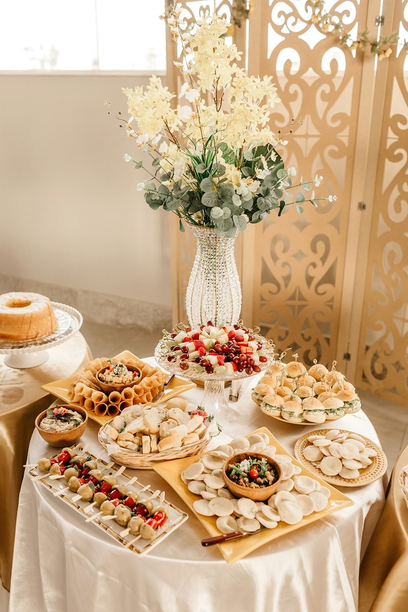 The wedding catering the friend's parents were supposed to give them as a gift, but cancelled a week before the wedding.