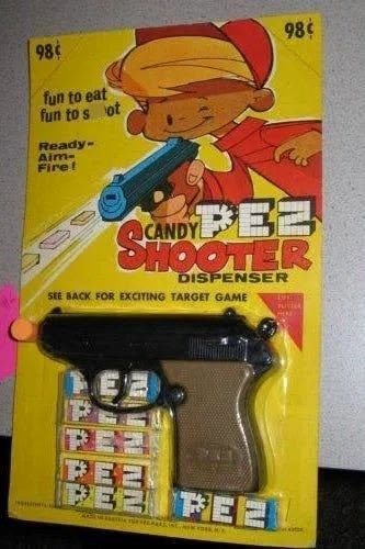 98 fun to eat fun to s ot Ready- Aim- Fire! 98¢ CANDY FEE SHOOTER DISPENSER SEE BACK FOR EXCITING TARGET GAME PE FEE