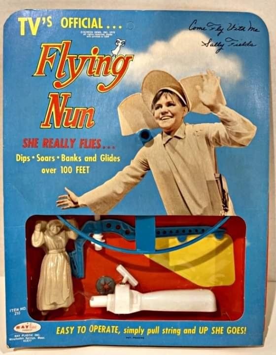 ITEM NO. 210 TV'S OFFICIAL. Flying Num SHE REALLY FLIES... Dips Soars Banks and Glides over 100 FEET Come Fly With Me Sally Fields RAY WAY PLASTIC EASY TO OPERATE, simply pull string and UP SHE GOES!