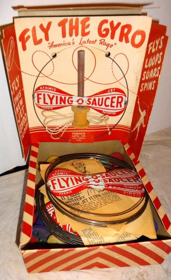 FLY THE GYRO "America's Latest Rage" NEW FLY JET FLYS LOOPS SOARS SPINS ATOMIC FLYING SAUCER FORMIS PATENTED FORMIS MFG.CO. CHATTANOOGA TENK. ATOMIC FLYING SAUCER FORMIS IT'S HEAL! THE NEW MYSTERY PARRIED SAUCER in the wa TRY. Ma' TOMIC-JET FLYING SAUC ·ball basking vom Save 100 સીમાં at BATERTED DINON