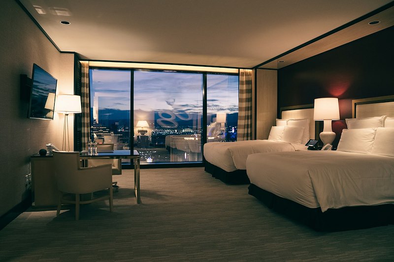 A hotel suite with a carpet on the floor.