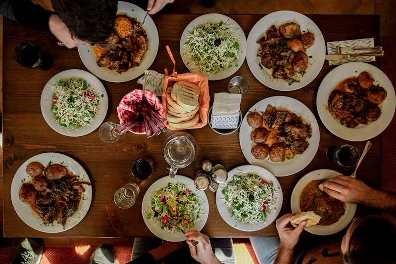 Thanksgiving dinner with a table full of food.