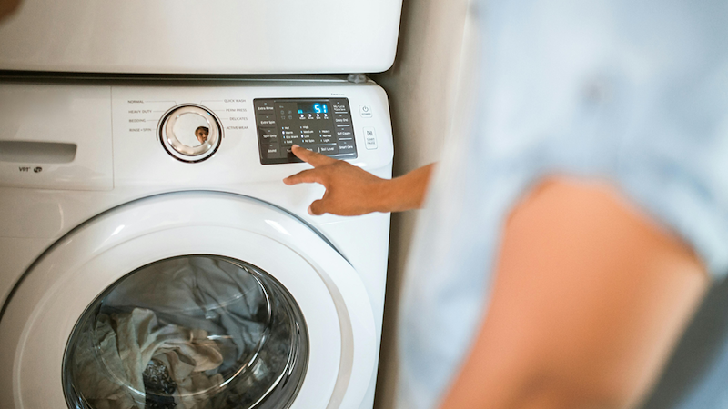 Person Using Their Washing Machine