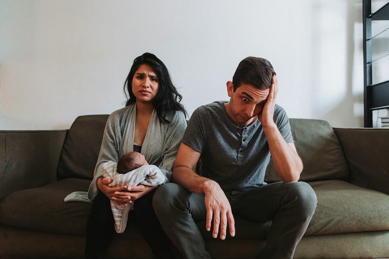 Tired parents with a baby.