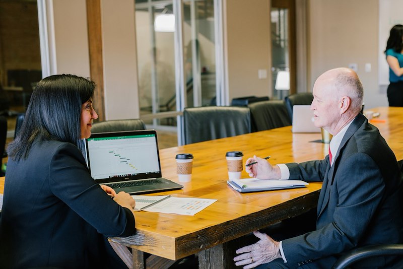 A woman and a man having a job meeting. Photo is a representation of scenes.