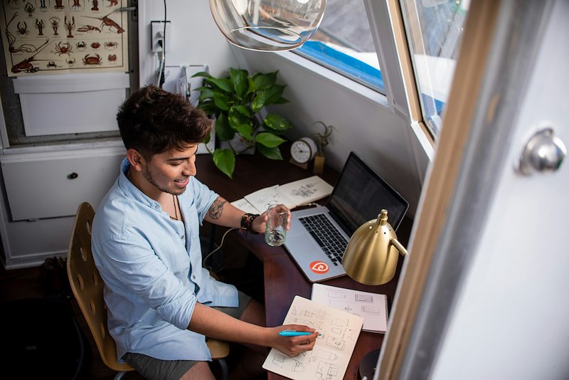 Man working remotly at his desk.