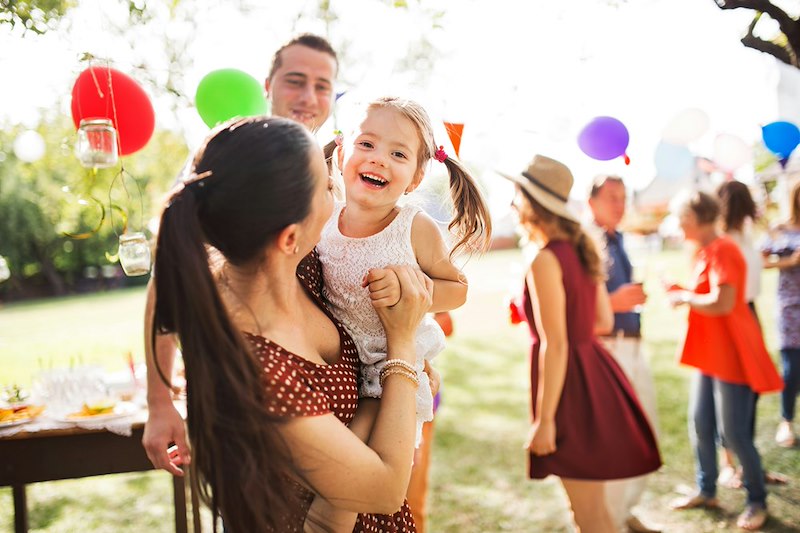 Woman attends her best friend's daughter's 6th birthday in a public park.