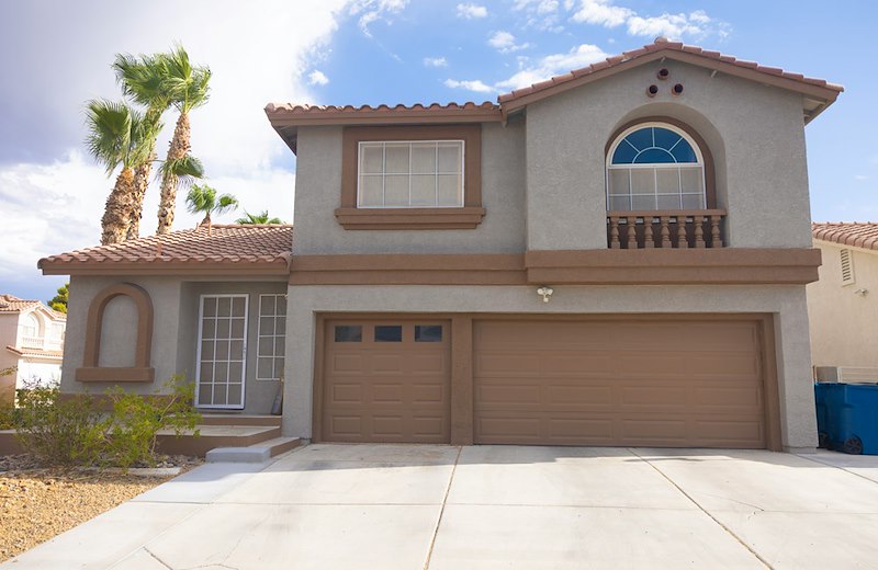 Suburban home with a concrete driveway.