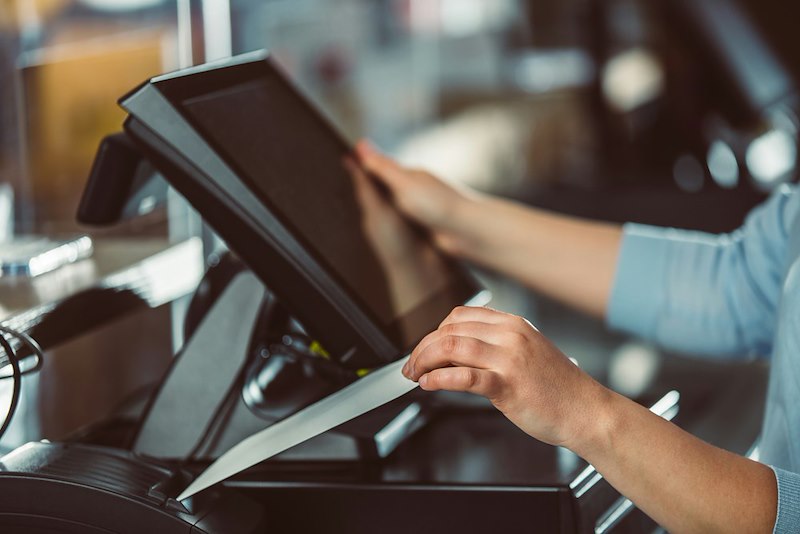 Employee at a cash register.
