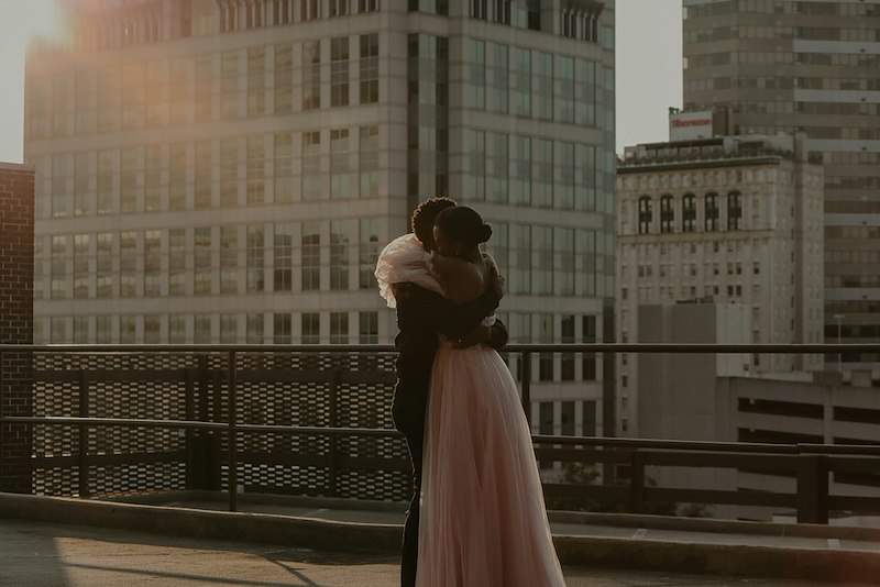 A couple getting married on a rooftop. Still frame for contextual reference only.