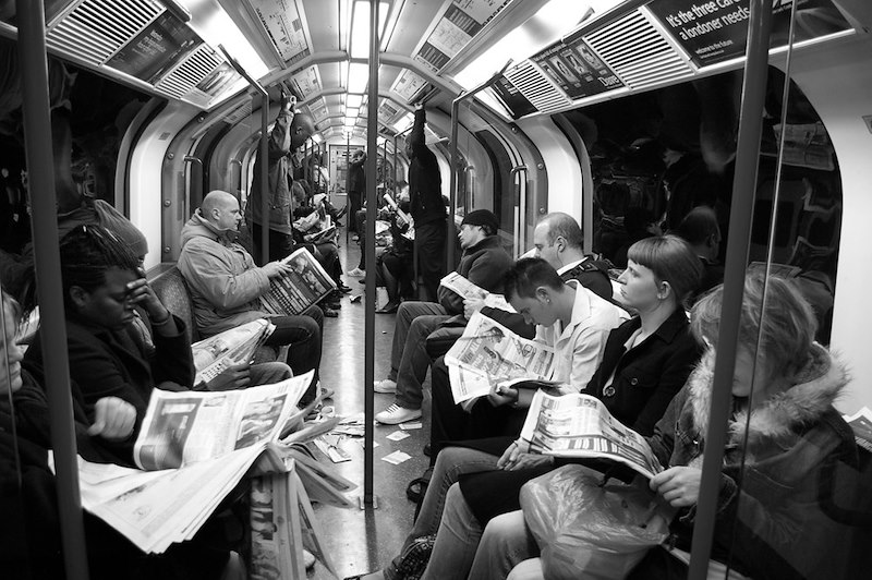 Commuters traveling on a crowded subway train.