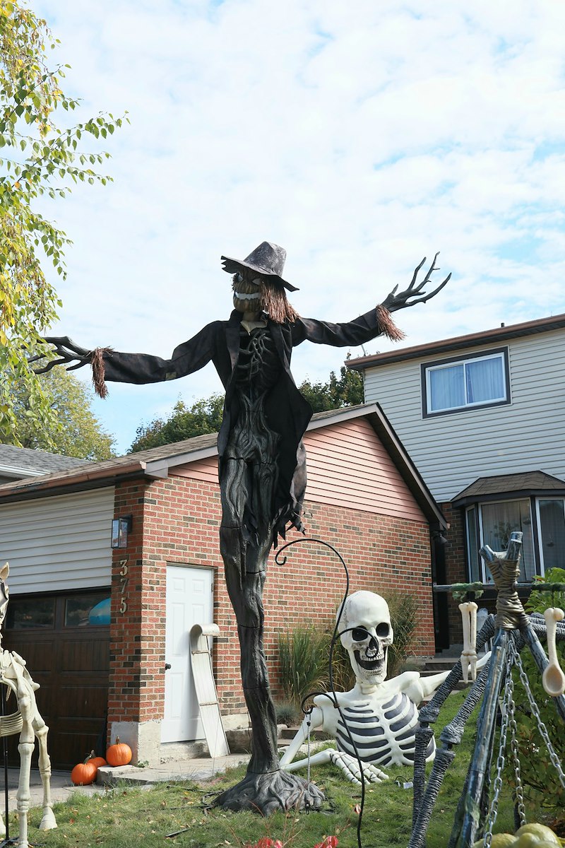 Elaborate Halloween decorations with a towering spooky figure.