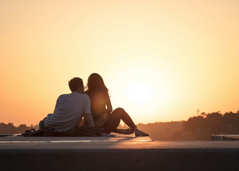 A couple enjoying a trip together. Recreated scenario included to enhance reader understanding.
