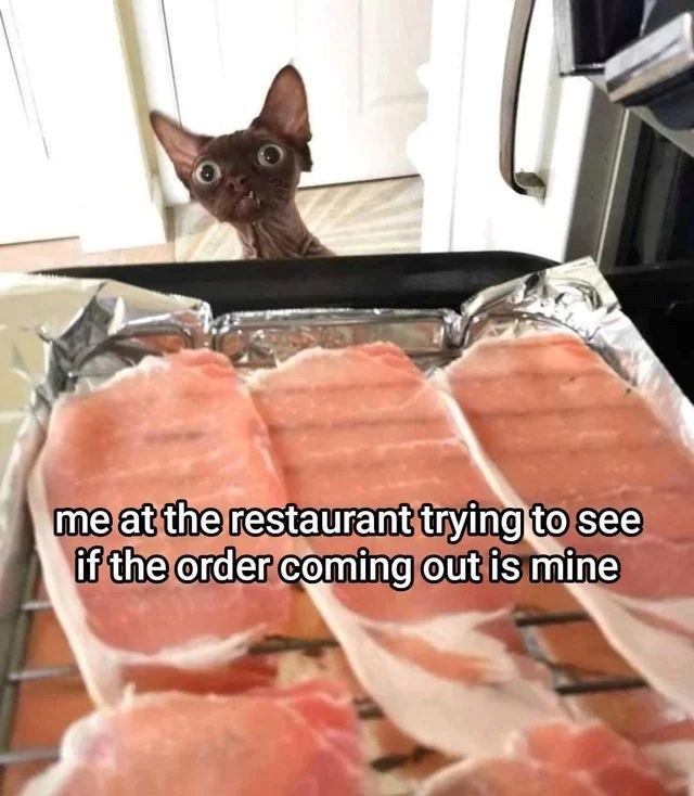 me at the restaurant trying to see if the order coming out is mine