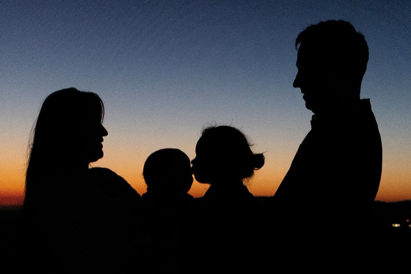 The silhouette of a 4-member family. Image for illustrative purposes.