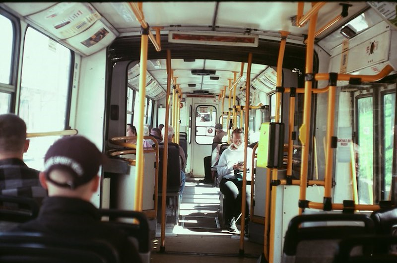Passengers ride a public bus