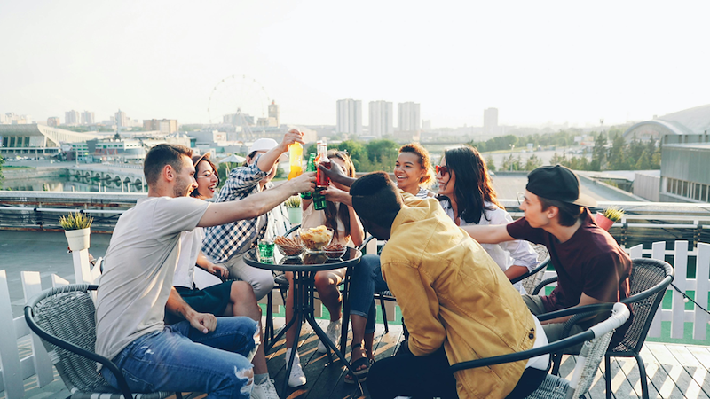 Group of friends enjoying food and drinks