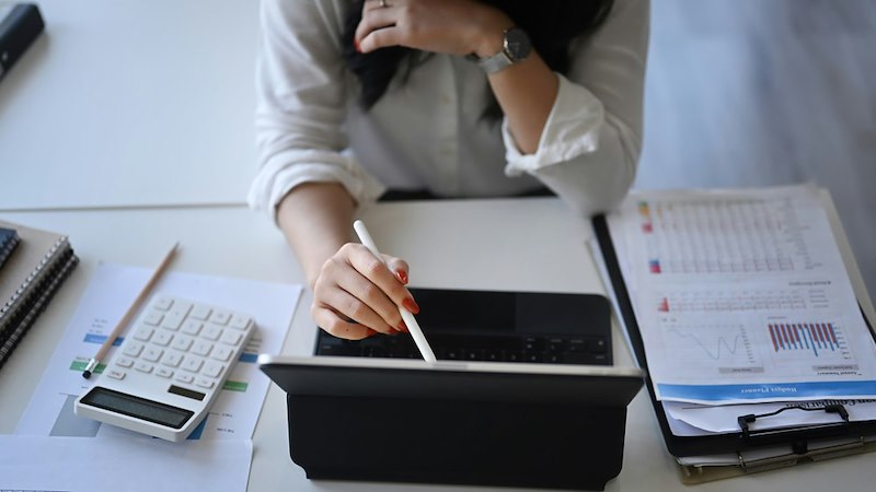 A finance worker works at her desk