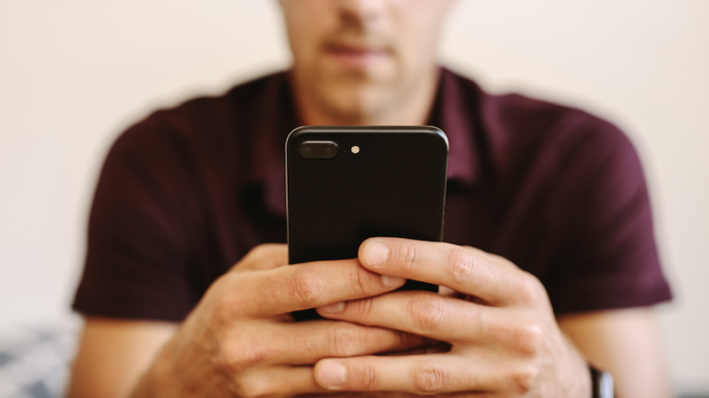 Man looking at banking information on his phone